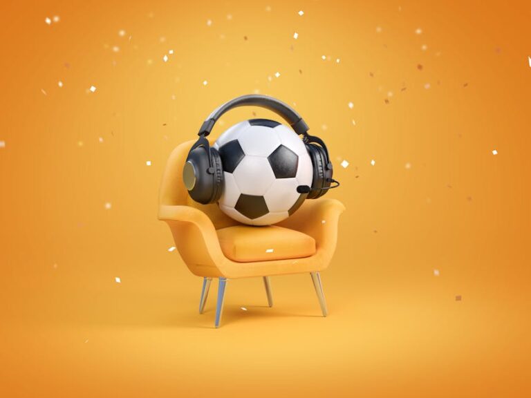 A soccer ball wearing headphones sits on a stylish chair, set against an orange background with confetti. World Cup Fan Anthems