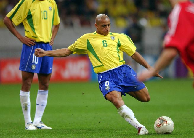Roberto Carlos kicking the ball, Saitama, Japan - Roberto Carlos. Brazil - Turkey, semi-final of the 2002 FIFA World Cup at the Saitama Stadium in the suburb of Tokyo.- World Cups Players