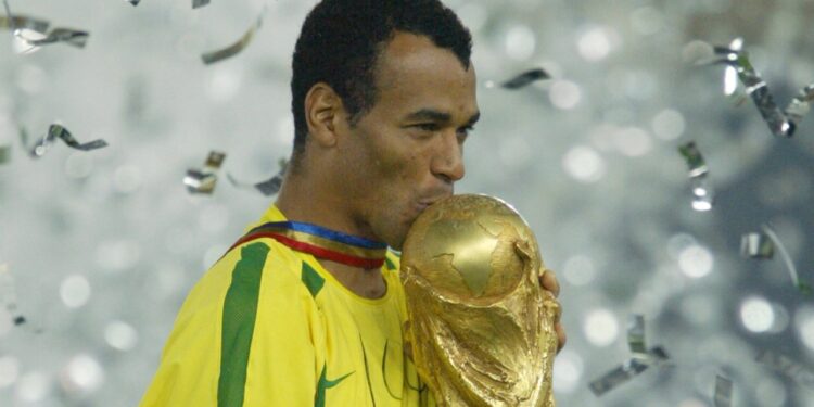 Cafu kissing the World Cup 2002 trophy. - World Cups Players