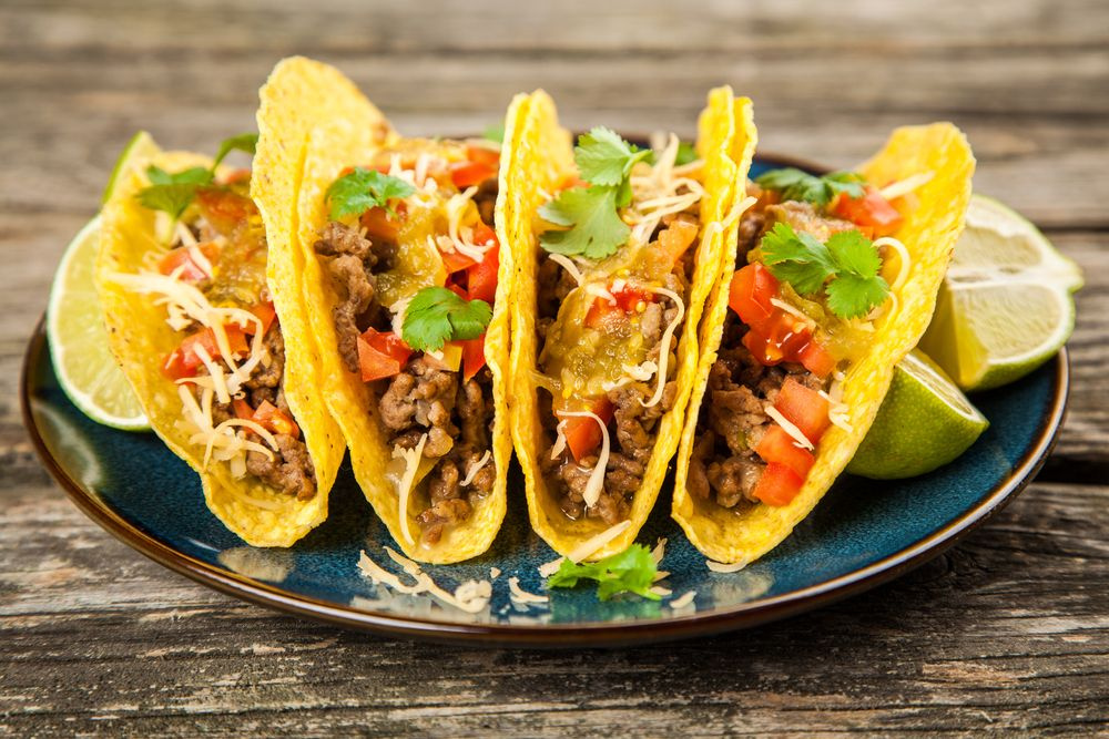 Mexican tacos al pastor and micheladas enjoyed during World Cup celebrations.
