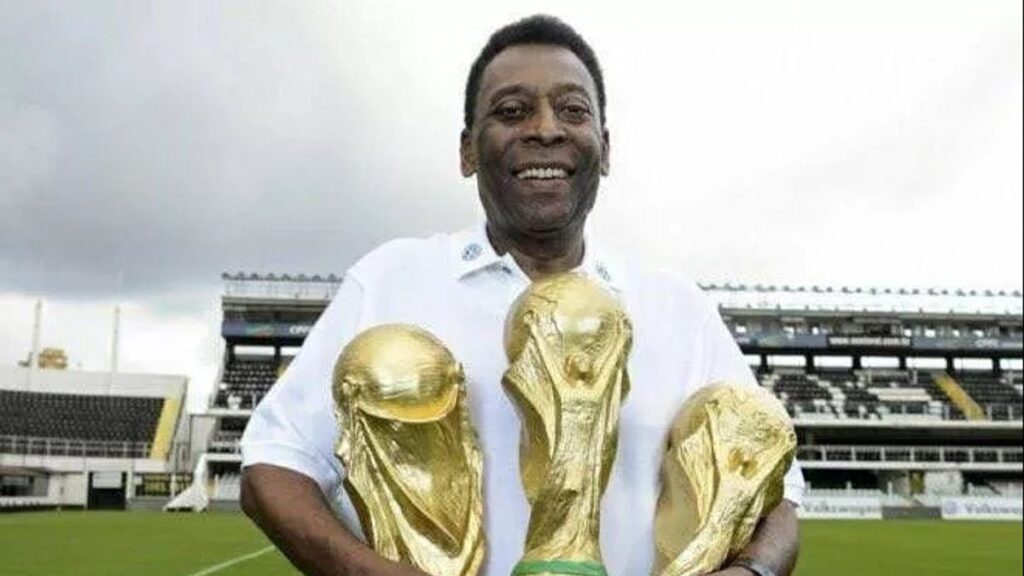 Brazil’s Pelé lifting World Cup trophy as teenage legend in 1958.