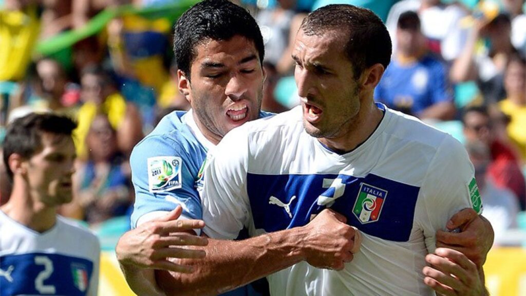 Luis Suárez biting Giorgio Chiellini during Uruguay vs Italy in 2014 World Cup.